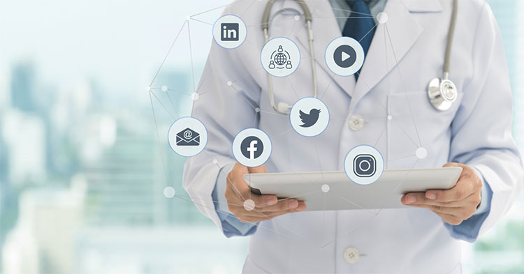 Doctor with tablet and social icons
