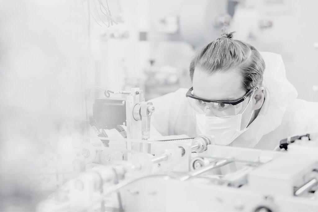 A researcher working in a medical device manufacturing facility